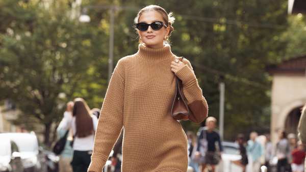 Inspiration: A guest wears a brown sweater turtleneck dress, brown bag, and black boots outside Bally during the Milan Fashion Week - Womenswear Spring/Summer 2024 on September 23, 2023 in Milan, Italy.