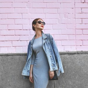 Street Style Shoot of Woman on Pink Wall. Swag Girl Wearing Jeans Jacket, grey Dress, Sunglass. Fashion Lifestyle Outdoor