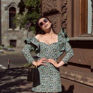 Young woman walking in summer city