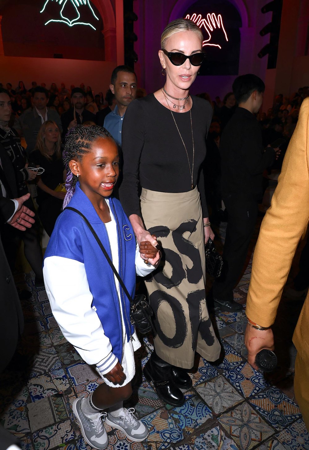 Charlize Theron Sits Front Row at Dior Pre-Fall Show With 7-Year-Old Daughter August