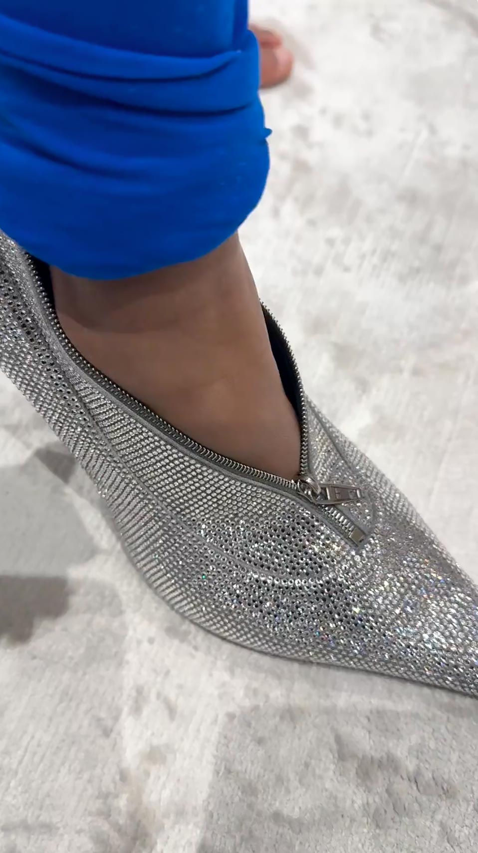 Chicago West tries wearing Kim Kardashian's Balenciaga shoe handbag as a heel