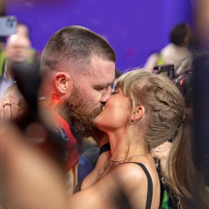 Travis Kelce Packs on PDA With Taylor Swift at Mahomes Charity Auction