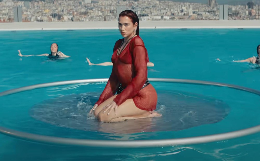 Dua Lipa Parties in Barcelona in Wet and Wild Video For New Song Illusion