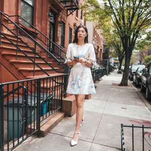 Young woman walking in the city street.