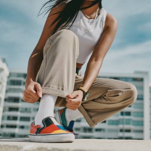 A woman checking out her shoe.