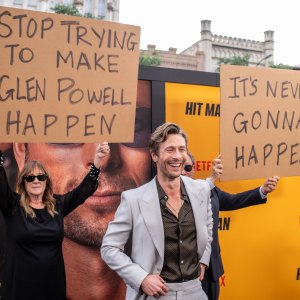 Glen Powell’s Parents Playfully Troll Him at ‘Hit Man’ Premiere