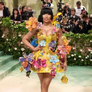 Nicki Minaj Puts On a Quirky Display in Canary Yellow Floral Appliqué Dress at the 2024 Met Gala