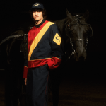 Man in Siegelman Stable tracksuit with horse