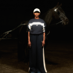 Woman in Siegelman Stables tracksuit with hourse