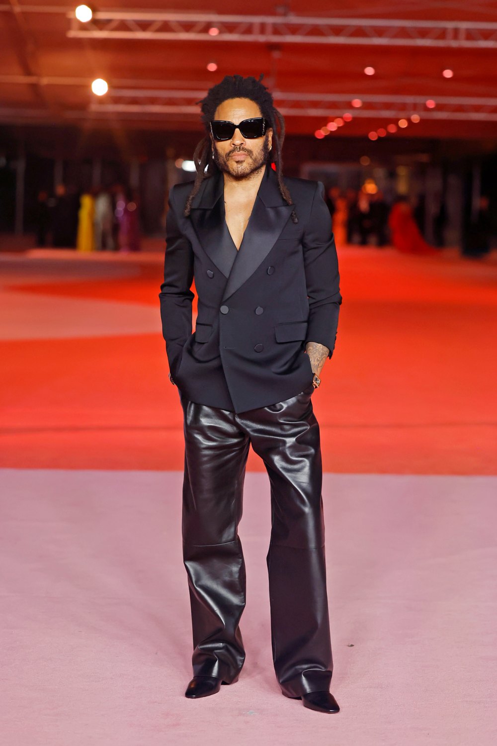 Why does Lenny Kravitz work in leather pants?