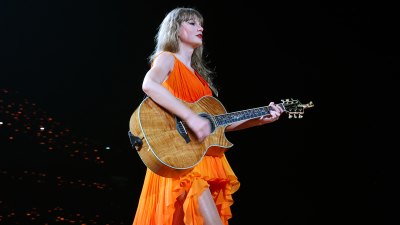 Taylor Swift Debuts Orange Surprise Song Dress During 3rd Paris Show
