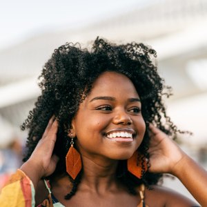 Smiling Black woman in the city