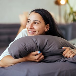 Portrait of a beautiful woman in bed in the morning