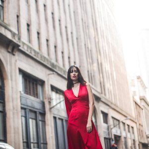 Beautiful woman walking down the city street