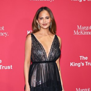 Chrissy Teigen Reveals Surgical Scar in Low Cut Dress Boobies Out