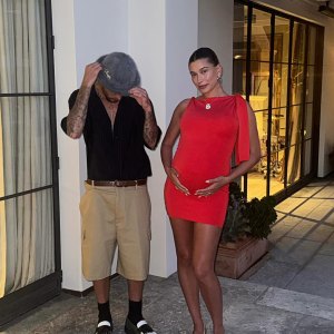 Pregnant Hailey Bieber Wows in Red Frock While Cradling Baby Bump With Justin Bieber