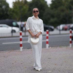 woman wearing striped white matching set on street