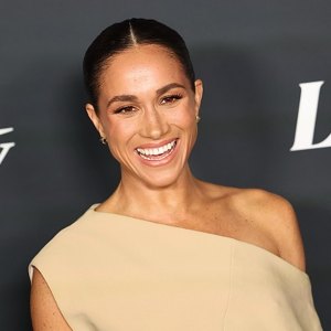 Meghan Markle wearing tan dress on red carpet