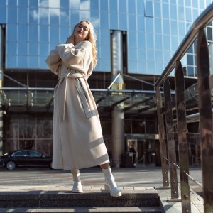 Young blonde woman in autumn city