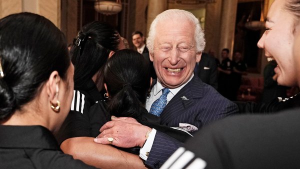 King Charles III Smiles During Healing Hug From New Zealand Rugby Team