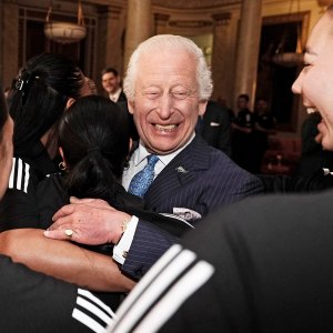 King Charles III Smiles During Healing Hug From New Zealand Rugby Team