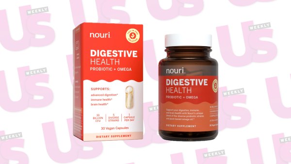 a box and a bottle in front of wallapaper