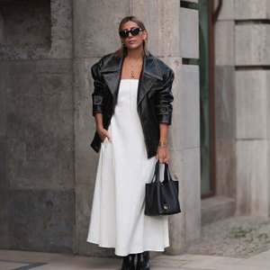 woman wearing white fall dress with black coat