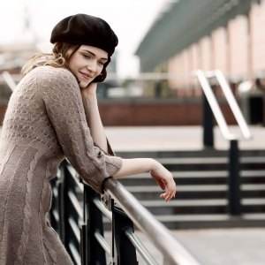 woman wearing a sweater dress in the city