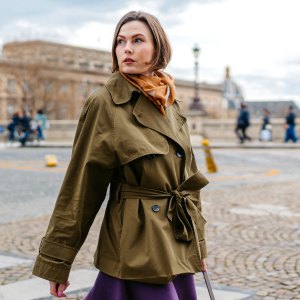 Beautiful young woman crossing the street in Paris in France.
