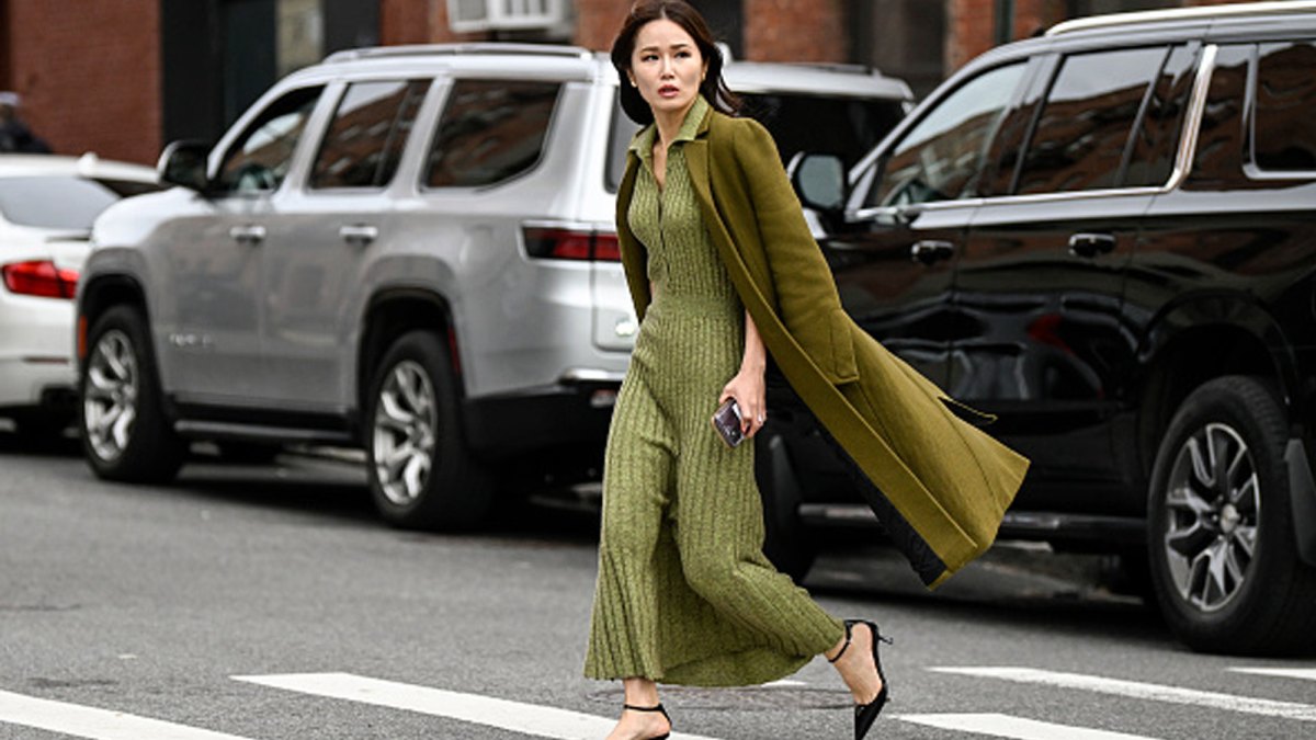 woman wearing green knitted sweater dress and trench coat