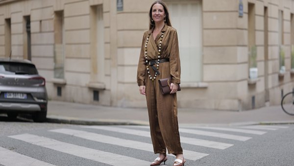 woman wearing loose-fitting brown jumpsuit