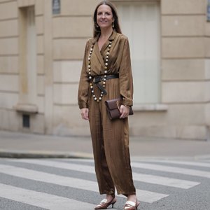 woman wearing loose-fitting brown jumpsuit
