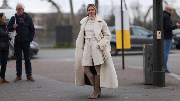 women wearing cream monochrome outfit and beige boots