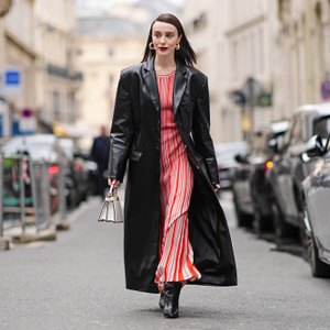 woman wearing red dress and black coat