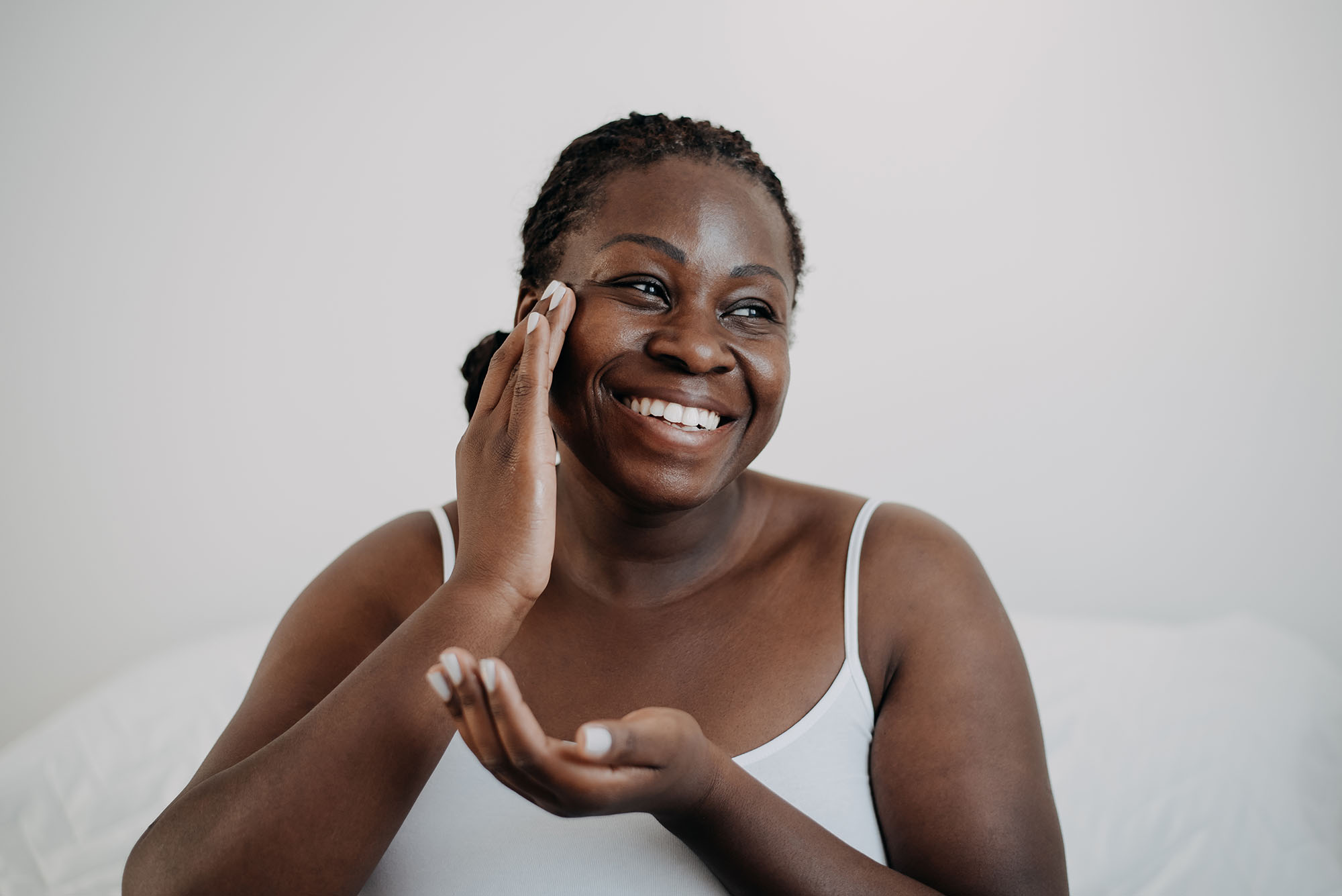 woman applying skincare