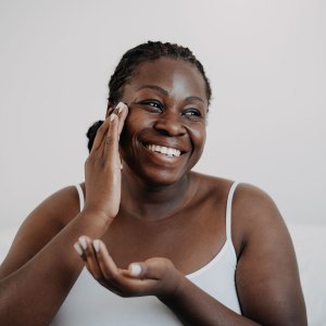 woman applying skincare