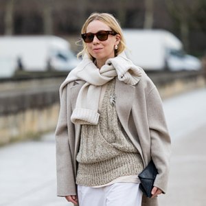 woman wearing beige sweater and coat