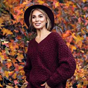 woman wearing burgundy loose sweater