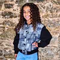 Dream Kardashian Poses Smiling at Camera