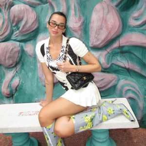 Dua Lipa Isn t Afraid to Mismatch Prints With Floral Boots With Funky Dress