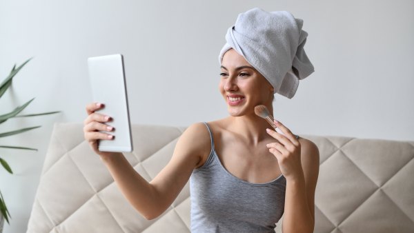 Smiling Female Enjoying The State Of Her Skin After Bath