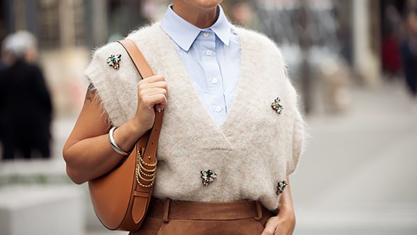 PARIS, FRANCE - SEPTEMBER 28: Gili Biegun wears brown balloon skirt, light blue shirt, beige knitted vest with accessories, brown bag outside the Vivienne Westwood show during Womenswear Spring/Summer 2025 as part of Paris Fashion Week on September 28, 2024 in Paris, France. (Photo by Raimonda Kulikauskiene/Getty Images)