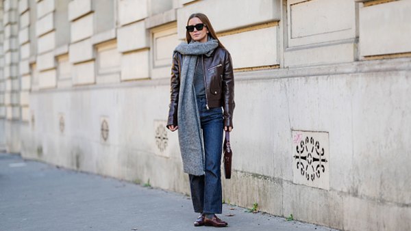 woman wearing jacket, jeans and scarf