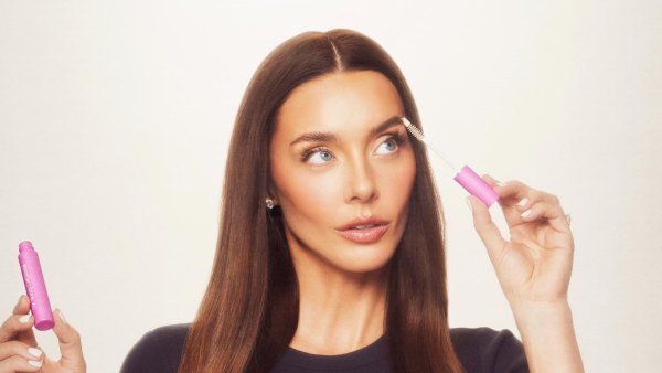 Lauryn Bosstick holding her peptide product 172