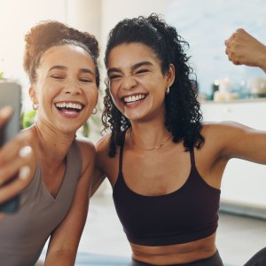 House, selfie and women with fitness, flexing and training with smile, confidence and pride. Smartphone, apartment and friends with happiness, wellness and excited with challenge, healthy and workout