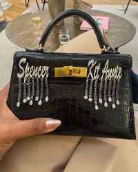 Mindy Kaling shows Hermes Custom Hermes Kelly with his children's names