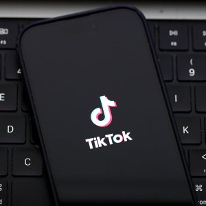 SAN ANSELMO, CALIFORNIA - DECEMBER 06: In this photo illustration, the TikTok logo is displayed on an iPhone screen on December 06, 2024 in San Anselmo, California. A three-judge panel of the U.S. Court of Appeals in Washington, D.C., has upheld a law mandating China-based ByteDance to sell the popular social media app TikTok or face a ban in the United States. ByteDance has until January 19, 2025 to sell the company. (Photo Illustration by Justin Sullivan/Getty Images)