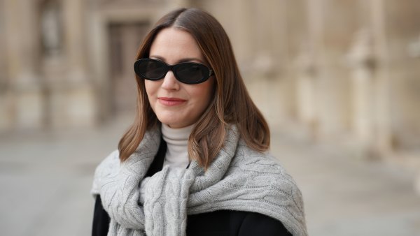 PARIS, FRANCE - DECEMBER 04: Marissa Cox wears black sunglasses, a white turtleneck pullover, a grey hoodie, a black blazer jacket, during a street style fashion photo session, on December 04, 2024 in Paris, France. (Photo by Edward Berthelot/Getty Images)