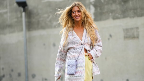 woman wearing purple cardigan and yellow pants