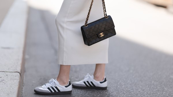 woman wearing adidas sneakers and Chanel bag
